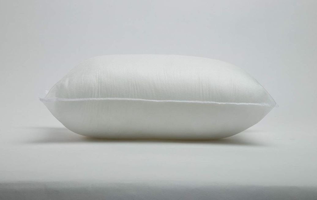 White pillow on a light gray background